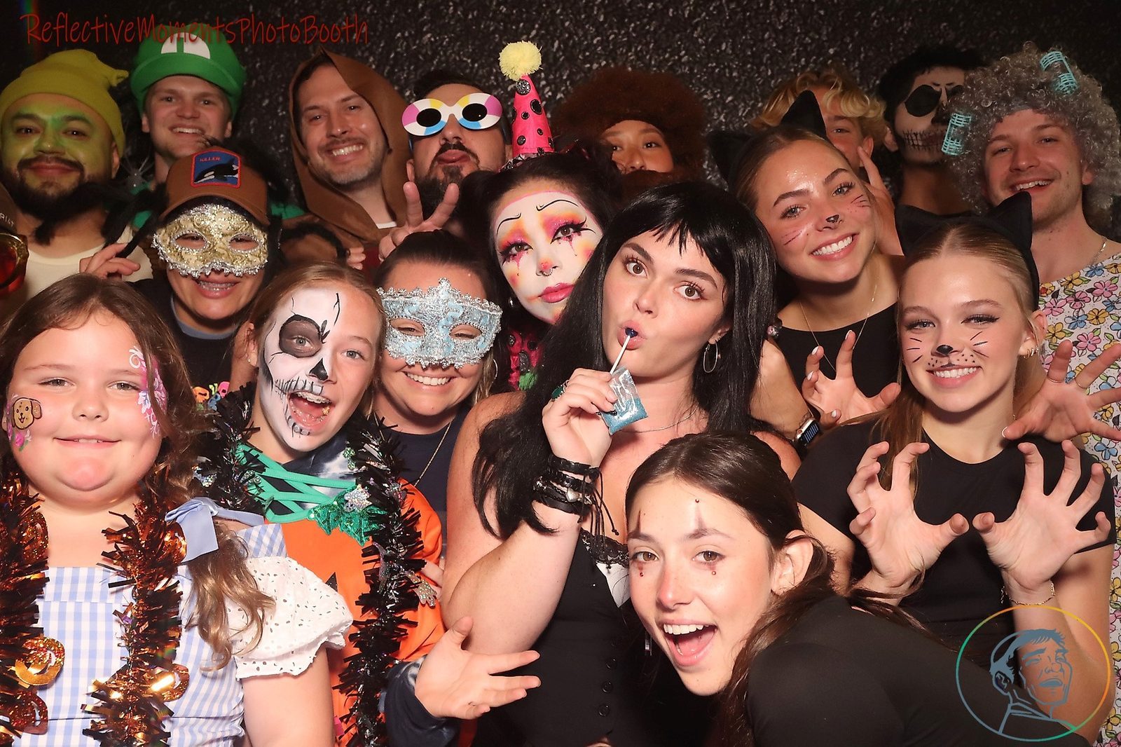 Late-night Halloween party guests at the mirror photo booth