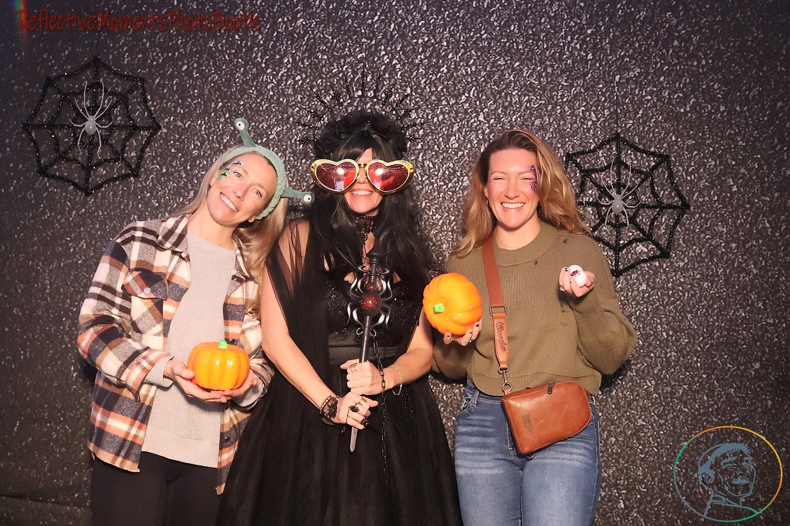Couple in Halloween costumes at the mirror photo booth