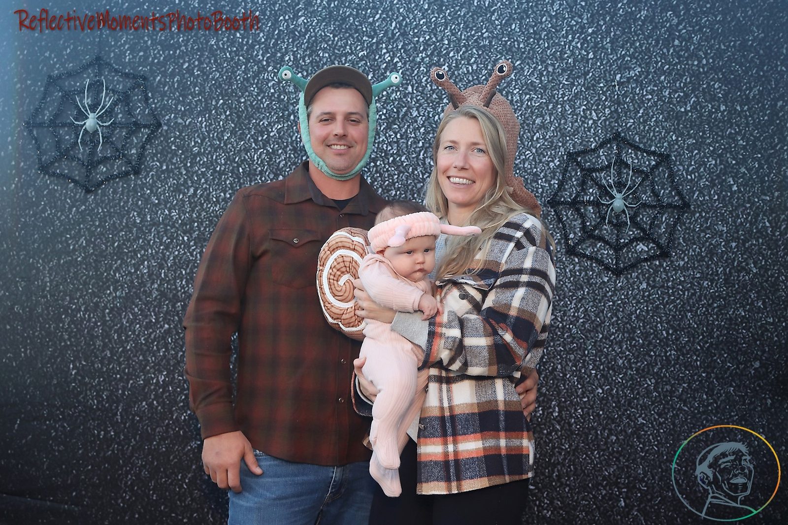 Guests in Halloween costumes posing at the mirror photo booth