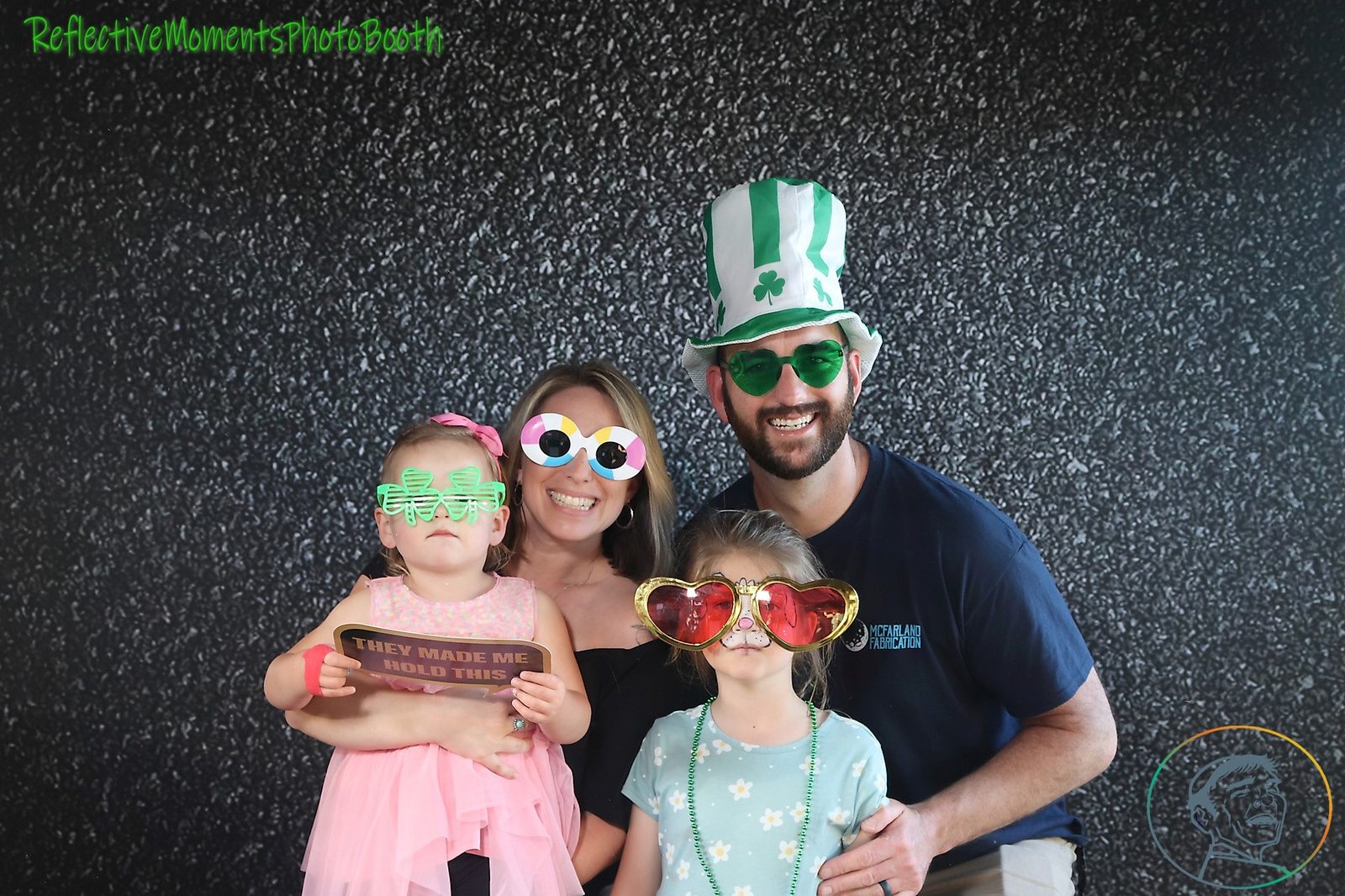 Saint Patrick's Day party guests laughing at the mirror booth