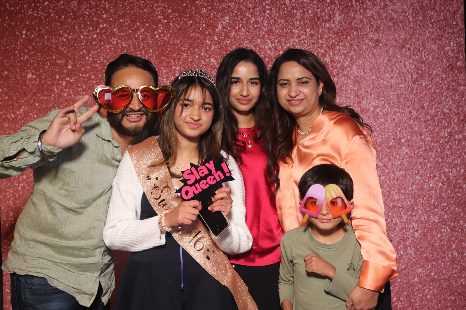Sweet 16 party guests enjoying the mirror photo booth experience